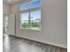 Inviting living room with stylish floors and a refreshing view of the outdoors at 814 Manns Harbor Dr, Apollo Beach, FL 33572