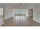 Spacious living room featuring hardwood floors, recessed lighting and large windows with scenic views at 814 Manns Harbor Dr, Apollo Beach, FL 33572