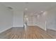 Open upstairs area with hardwood floors, staircase, and modern design at 814 Manns Harbor Dr, Apollo Beach, FL 33572