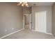 A neutral bedroom showcases a closet and doorway with a raised ceiling at 9106 Crystal Commons Way, Tampa, FL 33626