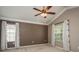 Bedroom with neutral colors, plush carpeting, and windows that flood the room with natural light at 9106 Crystal Commons Way, Tampa, FL 33626