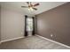 A cozy bedroom features neutral paint, plush carpet, and a ceiling fan at 9106 Crystal Commons Way, Tampa, FL 33626