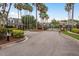 Gated community entrance with manicured landscaping, offering privacy and security at 9106 Crystal Commons Way, Tampa, FL 33626