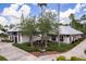 Community office building with palm trees, lush landscaping, and a welcoming entrance at 9106 Crystal Commons Way, Tampa, FL 33626