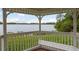 Lake view from inside a gazebo featuring built-in seating, perfect for enjoying the surrounding nature at 9106 Crystal Commons Way, Tampa, FL 33626