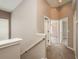The hallway includes carpet flooring and access to various rooms, enhancing the flow of the house at 9106 Crystal Commons Way, Tampa, FL 33626