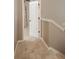 A hallway leads to carpeted bedrooms, offering a comfortable transition between living spaces at 9106 Crystal Commons Way, Tampa, FL 33626