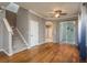 Living room showcases hardwood floors, staircase, and access to the outdoor patio at 9106 Crystal Commons Way, Tampa, FL 33626