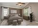 Cozy, staged bedroom featuring a large bed, vaulted ceilings and lots of natural light at 9106 Crystal Commons Way, Tampa, FL 33626