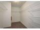 Walk-in closet providing ample storage space with wire shelving and carpeting at 9106 Crystal Commons Way, Tampa, FL 33626