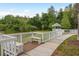 Walkway leading to gazebo by the lake with benches and a serene nature view at 9106 Crystal Commons Way, Tampa, FL 33626