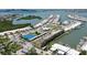 Stunning aerial view showcasing waterfront condos, community pool, and tennis courts at 1 Boca Ciega Point Blvd # 212, St Petersburg, FL 33708