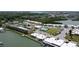 Aerial view showcasing the condos, pool, tennis courts, and surrounding waterways at 1 Boca Ciega Point Blvd # 212, St Petersburg, FL 33708