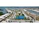 Aerial view of a waterfront community with tennis courts, a pool and boat docks at 1 Boca Ciega Point Blvd # 212, St Petersburg, FL 33708