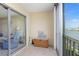 Enclosed tiled balcony featuring a lovely water view and comfortable furnishings at 1 Boca Ciega Point Blvd # 212, St Petersburg, FL 33708