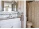 Well-lit bathroom with granite countertops, mosaic tile backsplash, and shower at 1 Boca Ciega Point Blvd # 212, St Petersburg, FL 33708