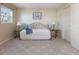 Cozy bedroom with a daybed, side tables, and a large window for natural light at 1 Boca Ciega Point Blvd # 212, St Petersburg, FL 33708
