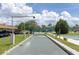Well-maintained bocce ball court surrounded by landscaping and trees in a community setting at 1 Boca Ciega Point Blvd # 212, St Petersburg, FL 33708