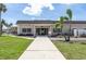 Exterior of the clubhouse with a well-manicured lawn and inviting entrance at 1 Boca Ciega Point Blvd # 212, St Petersburg, FL 33708