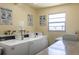 Well-lit community laundry room featuring modern, efficient washing machines, and a large window at 1 Boca Ciega Point Blvd # 212, St Petersburg, FL 33708