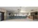 Spacious room with high, decorative ceilings, rows of seats and under-construction walls at 1 Boca Ciega Point Blvd # 212, St Petersburg, FL 33708