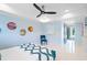 Bright bedroom offering modern decor, tranquil blue palette, and comfortable seating area near the outdoor deck at 10 Brightwaters Ne Cir, St Petersburg, FL 33704