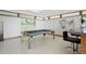 Game room with a pool table and bar, perfect for entertainment and relaxation at 10 Brightwaters Ne Cir, St Petersburg, FL 33704