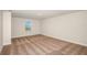 Neutral bedroom with carpet and one window overlooking a scenic view at 10025 Surrey Rose Dr, San Antonio, FL 33576