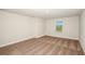 Neutral bedroom featuring carpet and a window at 10025 Surrey Rose Dr, San Antonio, FL 33576