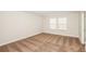 Clean and well-lit bedroom with neutral carpet, perfect for relaxation and rest at 10025 Surrey Rose Dr, San Antonio, FL 33576