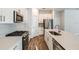 Contemporary kitchen with stainless steel appliances, quartz countertops, and modern finishes at 10025 Surrey Rose Dr, San Antonio, FL 33576