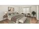 Serene main bedroom with neutral tones, soft carpet, and a comfortable seating area by the window at 10025 Surrey Rose Dr, San Antonio, FL 33576