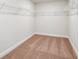 Spacious walk-in closet with ample shelving and storage space, ready for organization at 10025 Surrey Rose Dr, San Antonio, FL 33576