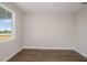 Bedroom with neutral walls, hardwood floors, a large window with lots of light at 10037 Surrey Rose Dr, San Antonio, FL 33576