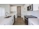 Modern kitchen showcasing white cabinets, stainless steel appliances and ample countertop space at 10037 Surrey Rose Dr, San Antonio, FL 33576