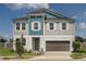 Charming two-story home featuring a modern design, landscaped yard, and a two-car garage at 10243 Fieldstone Myrtle Way, San Antonio, FL 33576