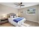 Comfortable bedroom with wood floors, ceiling fan, and natural light at 10884 118Th St, Seminole, FL 33778