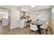 Inviting dining room featuring wood floors and a view into the modern kitchen at 10884 118Th St, Seminole, FL 33778
