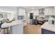 Bright kitchen with white countertops, stainless steel appliances, and adjacent living area at 10884 118Th St, Seminole, FL 33778