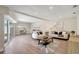Bright living room boasts wood floors, recessed lighting and access to the outdoors at 10884 118Th St, Seminole, FL 33778