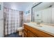 Bathroom featuring a tub, vanity, commode, and a mirror at 11831 104Th Ln, Largo, FL 33773