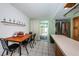 Bright eat-in kitchen featuring tile floors and a convenient sliding glass door to the outdoor patio at 11831 104Th Ln, Largo, FL 33773