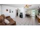 Living room with tile floors, comfortable seating, and an open layout at 11831 104Th Ln, Largo, FL 33773