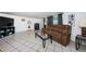 Cozy living room with a sofa, tiled floors, and a glass coffee table, perfect for relaxation at 11831 104Th Ln, Largo, FL 33773