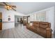 Living room featuring a comfortable sofa, tile floors, and an open floor plan at 11831 104Th Ln, Largo, FL 33773