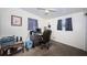 Functional office space with a ceiling fan, desk and chair, offering a practical workspace at 11831 104Th Ln, Largo, FL 33773