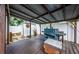 View of covered patio with a grill and shed, great for outdoor entertaining and storage at 11831 104Th Ln, Largo, FL 33773