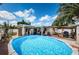 Aerial view of backyard featuring a refreshing in-ground pool, patio, and outdoor amenities at 11831 104Th Ln, Largo, FL 33773