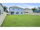 Backyard featuring a lush green lawn and privacy fence, ideal for outdoor activities and entertaining at 11911 Greenchop Pl, Riverview, FL 33579