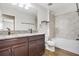 Bathroom features granite countertops, dual sinks, tub and shower combo at 11911 Greenchop Pl, Riverview, FL 33579